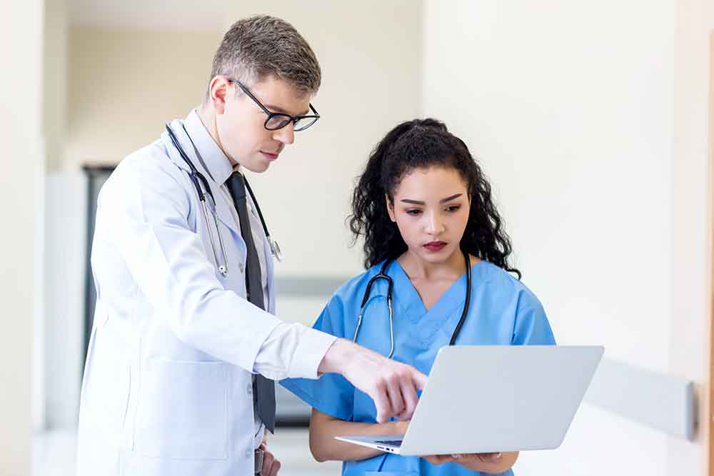 Medical Doctors looking at medical billing documents